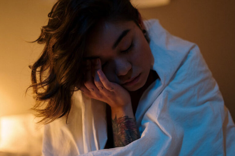 The woman is tired and cannot sleep.