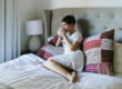 Sleep-Friendly Bedroom - a woman drinking the cup of tea.