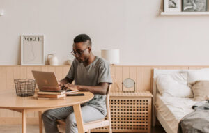 Home Office. Man sitting and working at the table.